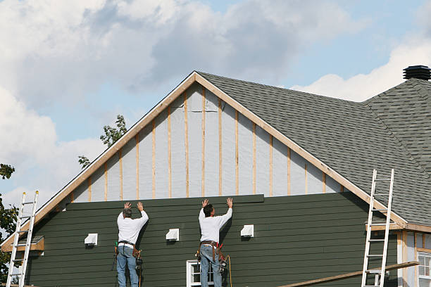 Professional Siding technician working in Plainville, CT